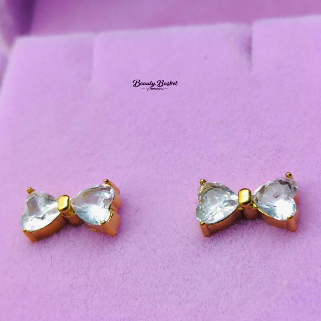 bow crystal stud earrings stainless steel gold tone close view