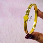 clover design bangle stainless steel gold tone close view