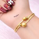 double ball design bangle stainless steel gold tone full view