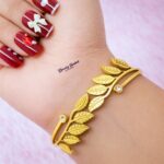 leaf design bangle stainless steel gold tone close view