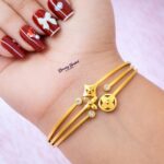 multi charm design bangle stainless steel gold tone full view